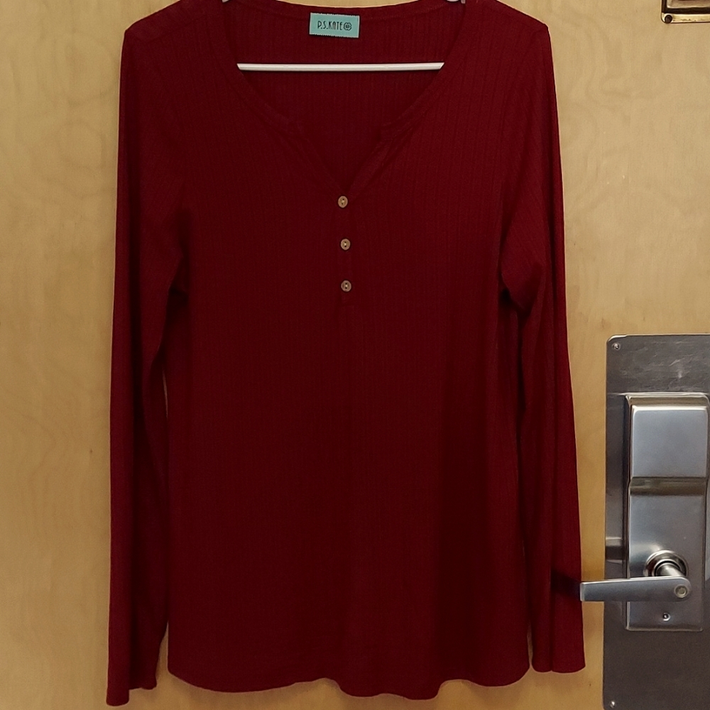 Long sleeve is by P.S. Kate in a size Large in the color maroon.
